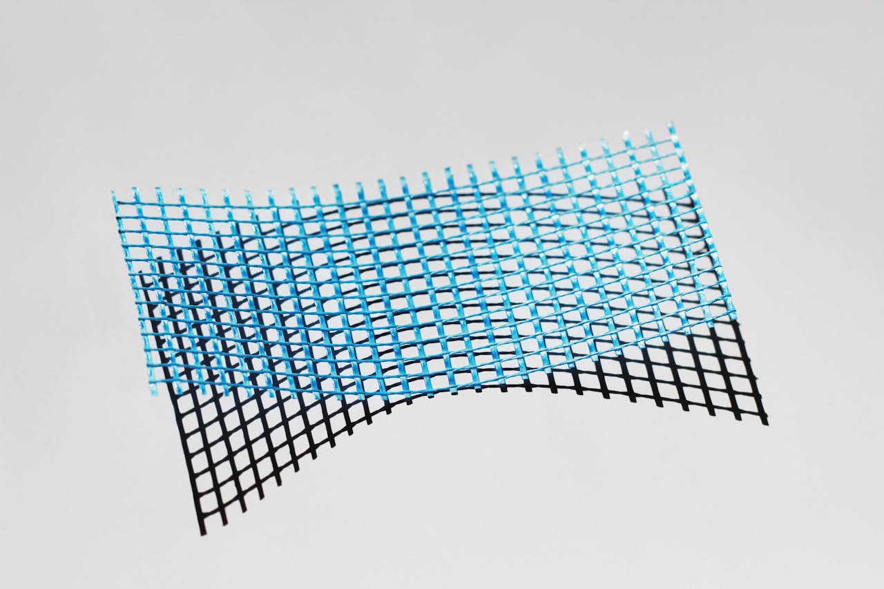 Unique abstract art featuring a blue and black textured mesh grid on a neutral background.
