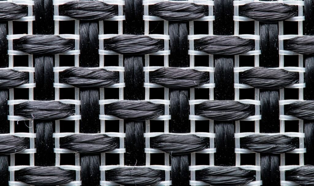 Detailed view of a black and white woven textile pattern in macro photography.